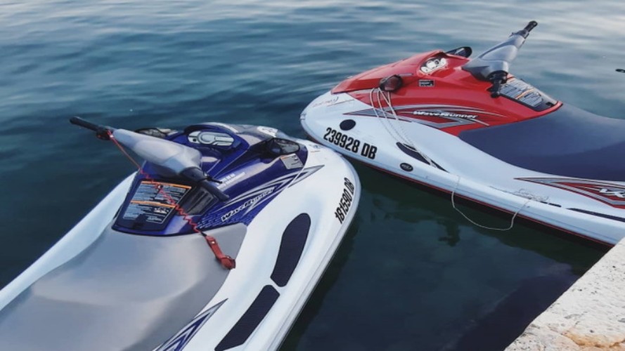 A person driving a jet ski on the sea